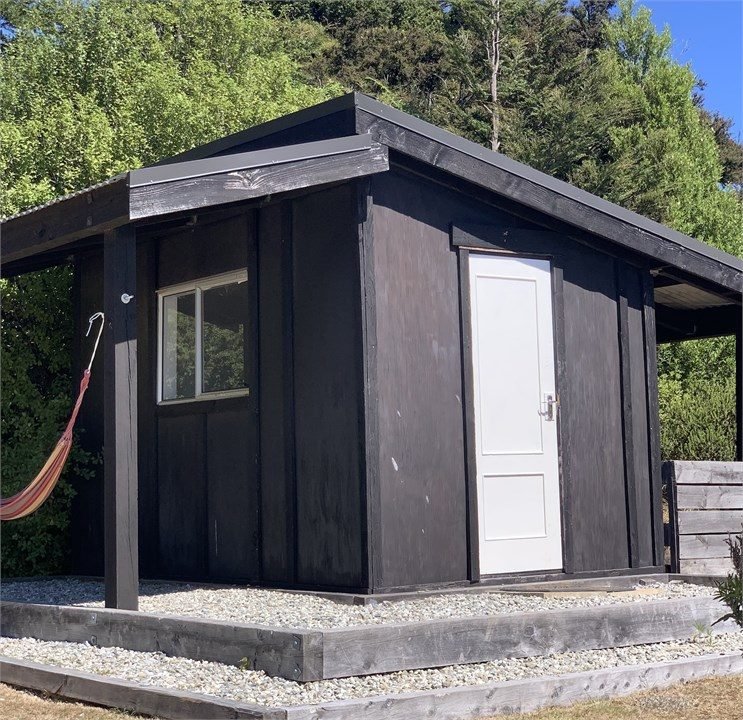 Sleep-out bedroom at The Black Shack, Lake Hawea