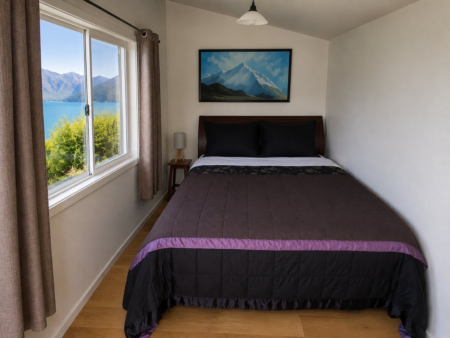 Sleep-out bedroom at The Black Shack, Lake Hawea, with lake view