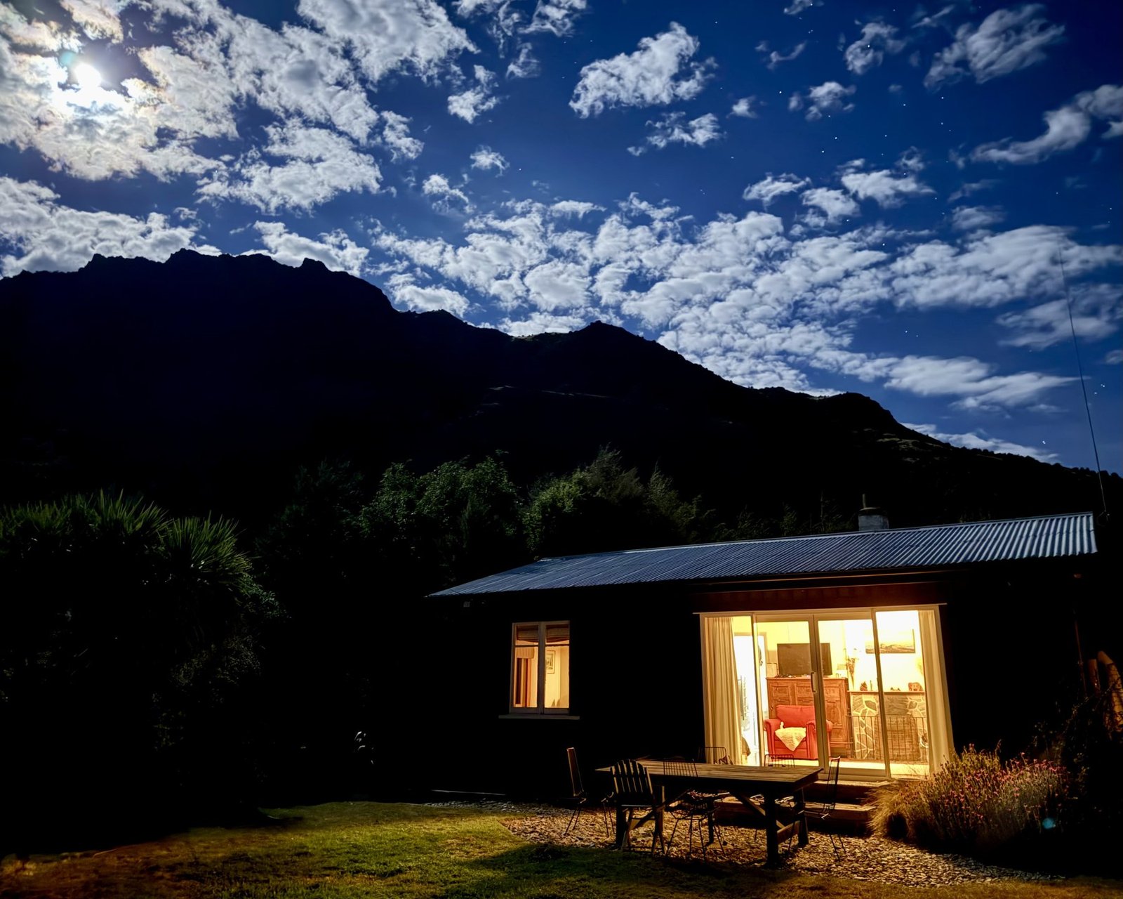 The Black Shack at night under the moon, Lake Hawea