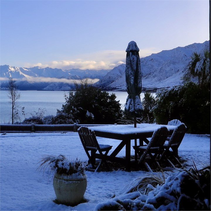 The Black Shack exterior in winter snow, Lake Hawea
