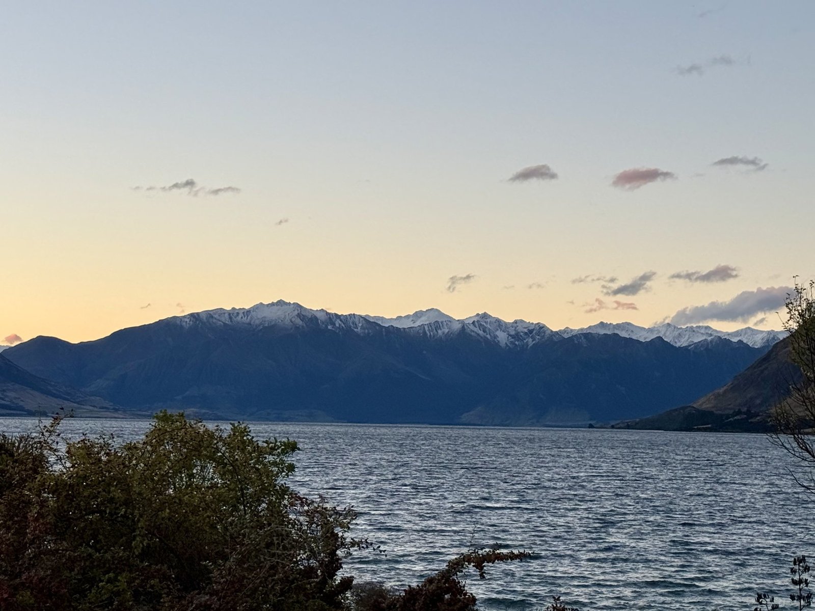 Lake Hawea with snow-capped mountains at sunset