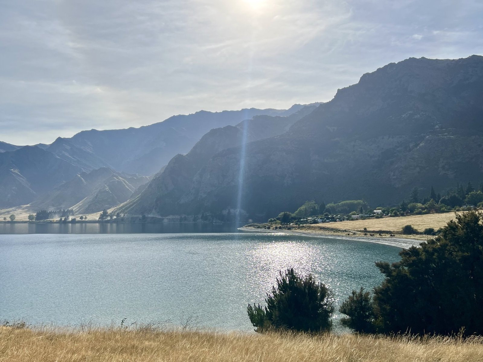 Sunlight over Lake Hawea and the mountains