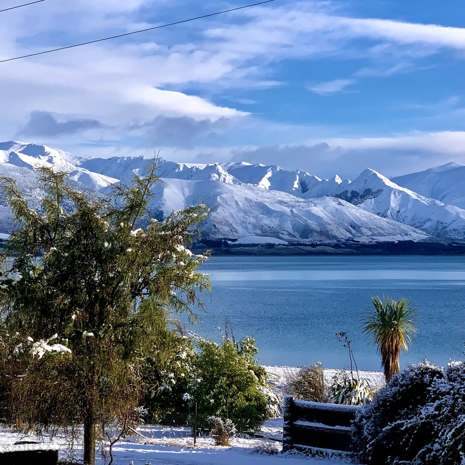 Lake Hawea in winter with snow-capped mountains