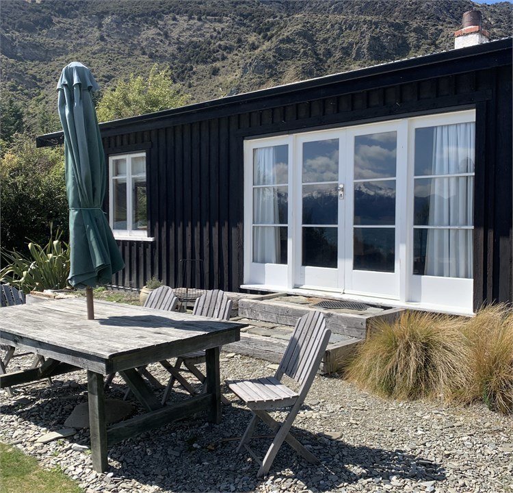 Outdoor dining table at The Black Shack, Lake Hawea